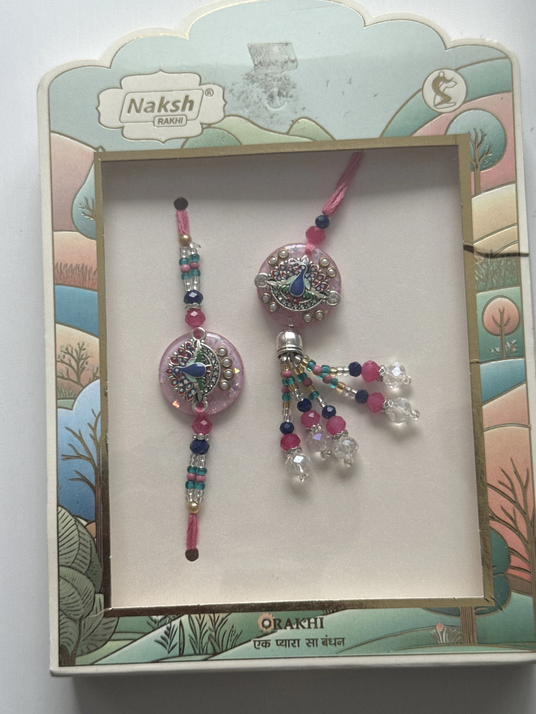 Bhaiya Bhabhi Peacock Rakhi Set (Pink)