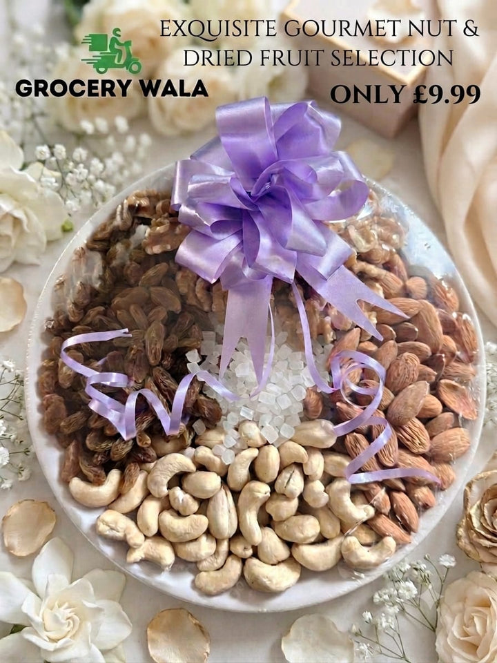 Exquisite gourmet nut and dried fruit selection on a ceramic plate with purple satin ribbon bow — cashews, almonds, brown raisins and sugar crystals