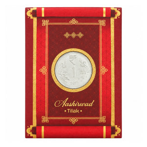 Aashirvaad Tilak red packet with shagun coin on white background