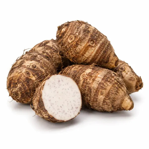 Fresh arbi taro roots on a white background