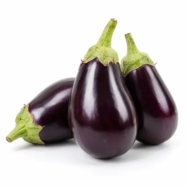 Fresh purple aubergines on a white background