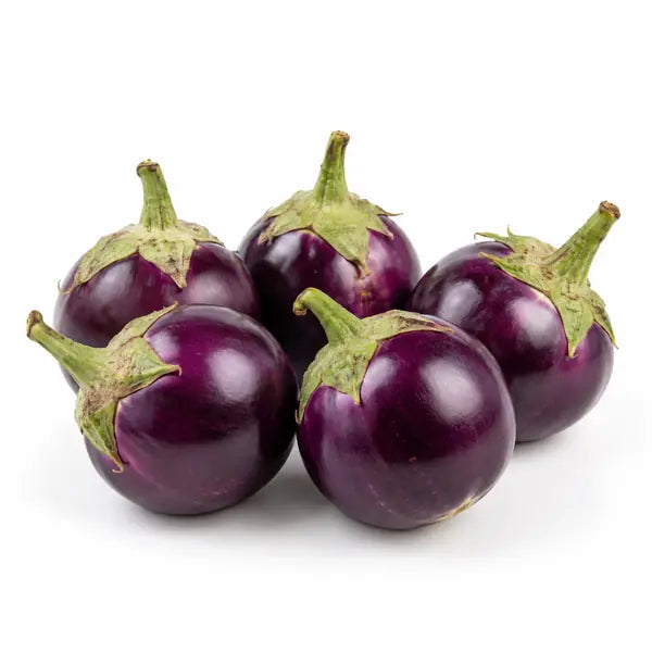 Fresh round ravaya aubergines on a white background