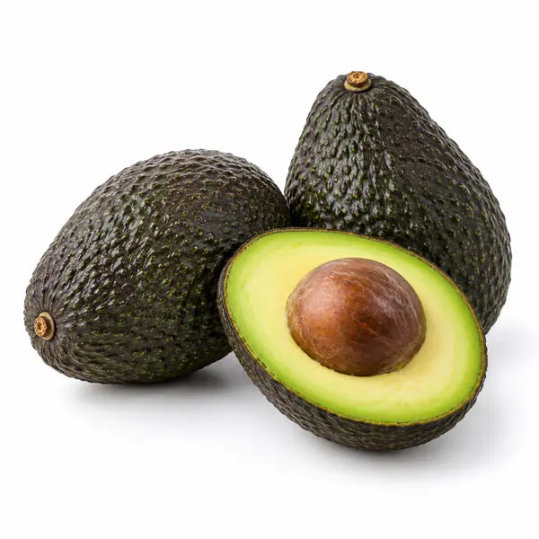 Fresh ripe avocados on a white background