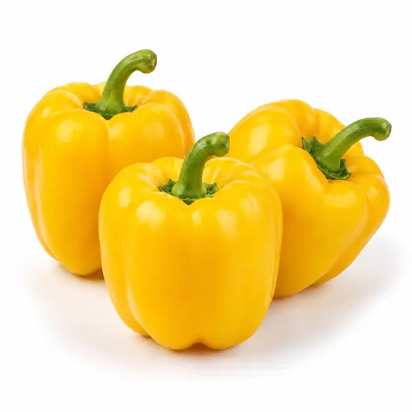 Fresh yellow bell peppers on a white background