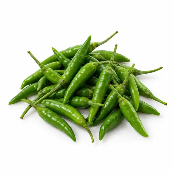 Fresh green bird's eye chillies on a white background