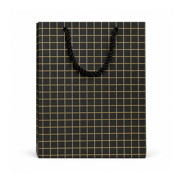 Black and gold grid gift bag with rope handles on white background