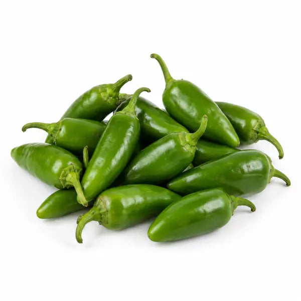 Fresh green bullet chillies on a white background