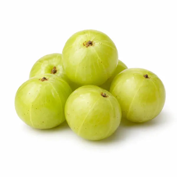 Fresh green Indian gooseberries (amla) on a white background