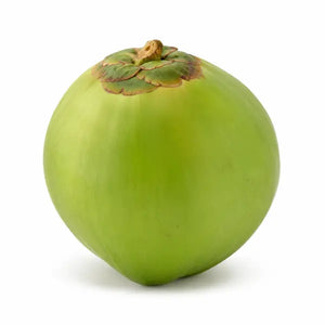Fresh uncut green coconut on a clean white background