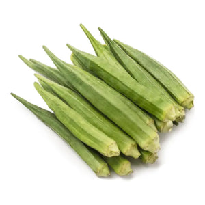 Fresh whole green okra pods on a clean white background