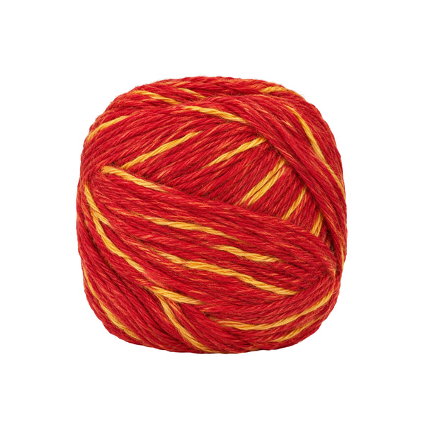 Red and yellow Kalava Mauli sacred thread ball, one piece, on white background