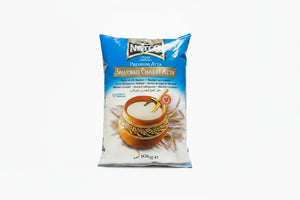 Natco Sharbati Chakki Atta 10kg blue and white bag, front view