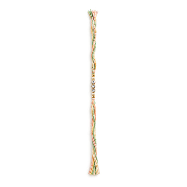 Pastel Elegance Rakhi with crystal beads on white background