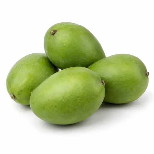 Fresh raw green mangoes on a white background