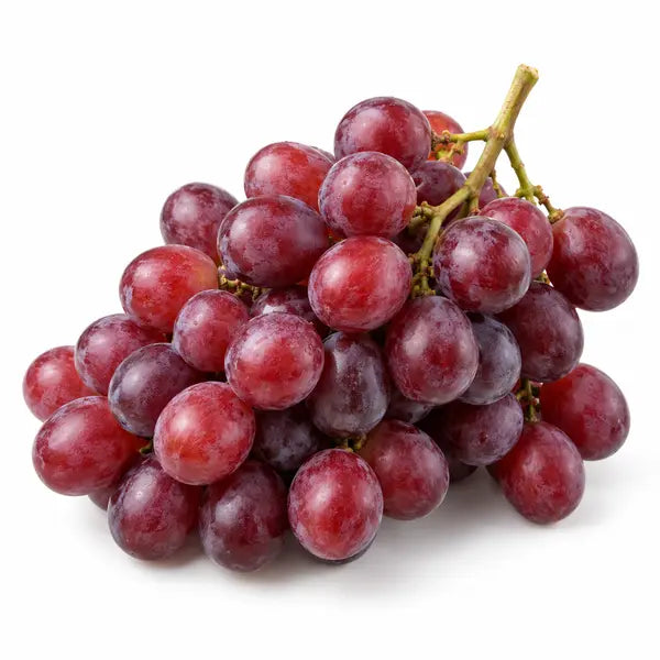 Fresh red seedless grapes on a white background
