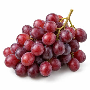 Fresh red seedless grapes on a white background