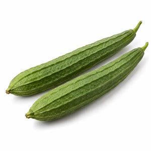 Fresh turia ridge gourds on a white background