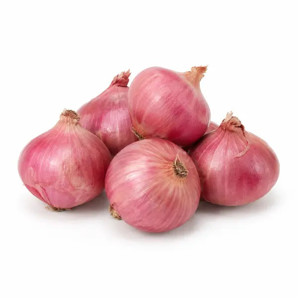 Fresh Indian pink Bombay onions on a white background