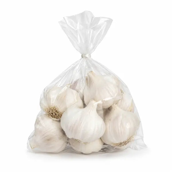 Small pre-pack of fresh garlic bulbs on a white background