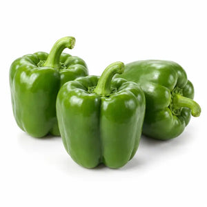 Fresh green bell peppers on a white background
