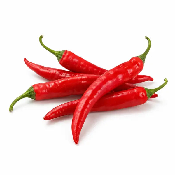 Fresh red hot peppers on a white background