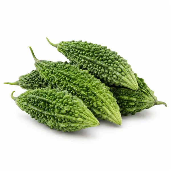 Fresh karela bitter gourds on a white background