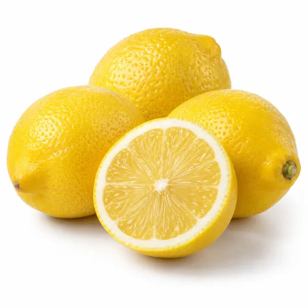 Fresh yellow lemons with cut fruit on a white background