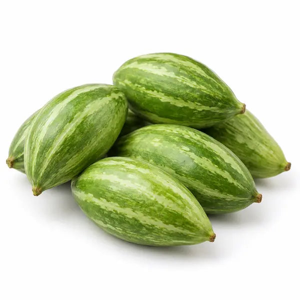 Fresh parval pointed gourds on a white background