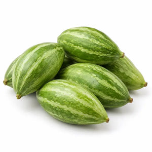 Fresh parval pointed gourds on a white background