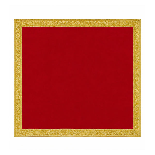 Plain red velvet pooja cloth with decorative gold border on white background
