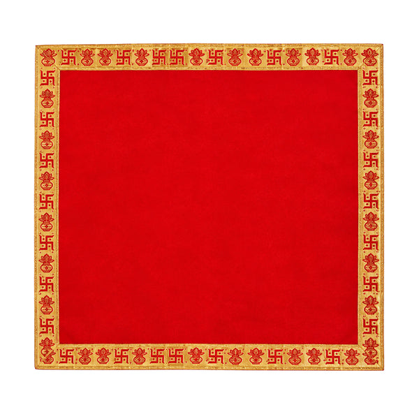 Red Pooja velvet cloth with gold Swastik and Kalash design on white background