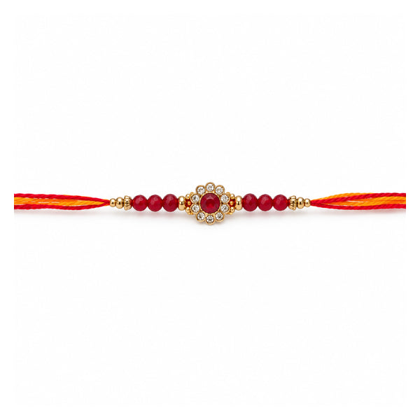Ruby Floral Stone Rakhi with red thread on white background