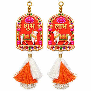 Shubh Labh cow hanging pair with lotus motifs, orange and white tassels and pearl-style bead loops