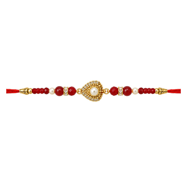 Shuddh Bandhan Rakhi with red and gold beads, centred on white background