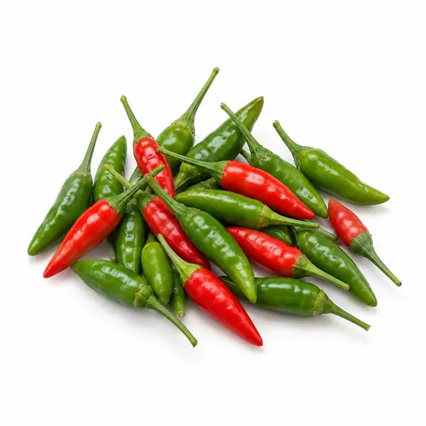 Fresh red and green Thai chillies on a white background